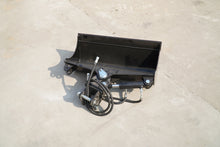 Rippa Australia black excavator tilt bucket attachment with hydraulic components on concrete