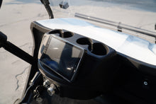Dashboard of a golf cart featuring a digital display and cup holders for convenience