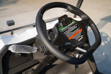 Close-up of a Golf Cart steering wheel with performance indicators and a sleek design
