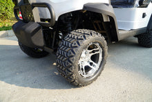 Close-up of rugged tires on a Labadi Engineering Golf Cart with chrome alloy rims for enhanced performance