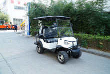 Labadi Engineering Golf Cart in white with black accents parked on a pathway surrounded by greenery