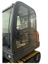 Close-up view of a Labadi Engineering excavator cab showcasing clear access and control features