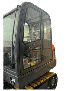 Close-up view of a Labadi Engineering excavator cab showcasing clear access and control features