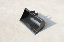 Rippa Australia black mud bucket excavator attachment on concrete surface