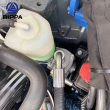 Close-up of Mini Excavato hydraulic system showing fluid reservoir and hoses